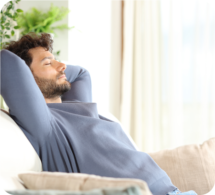 a man relaxing on a sofa