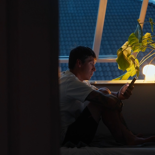 a man making a financial transaction on his cell phone